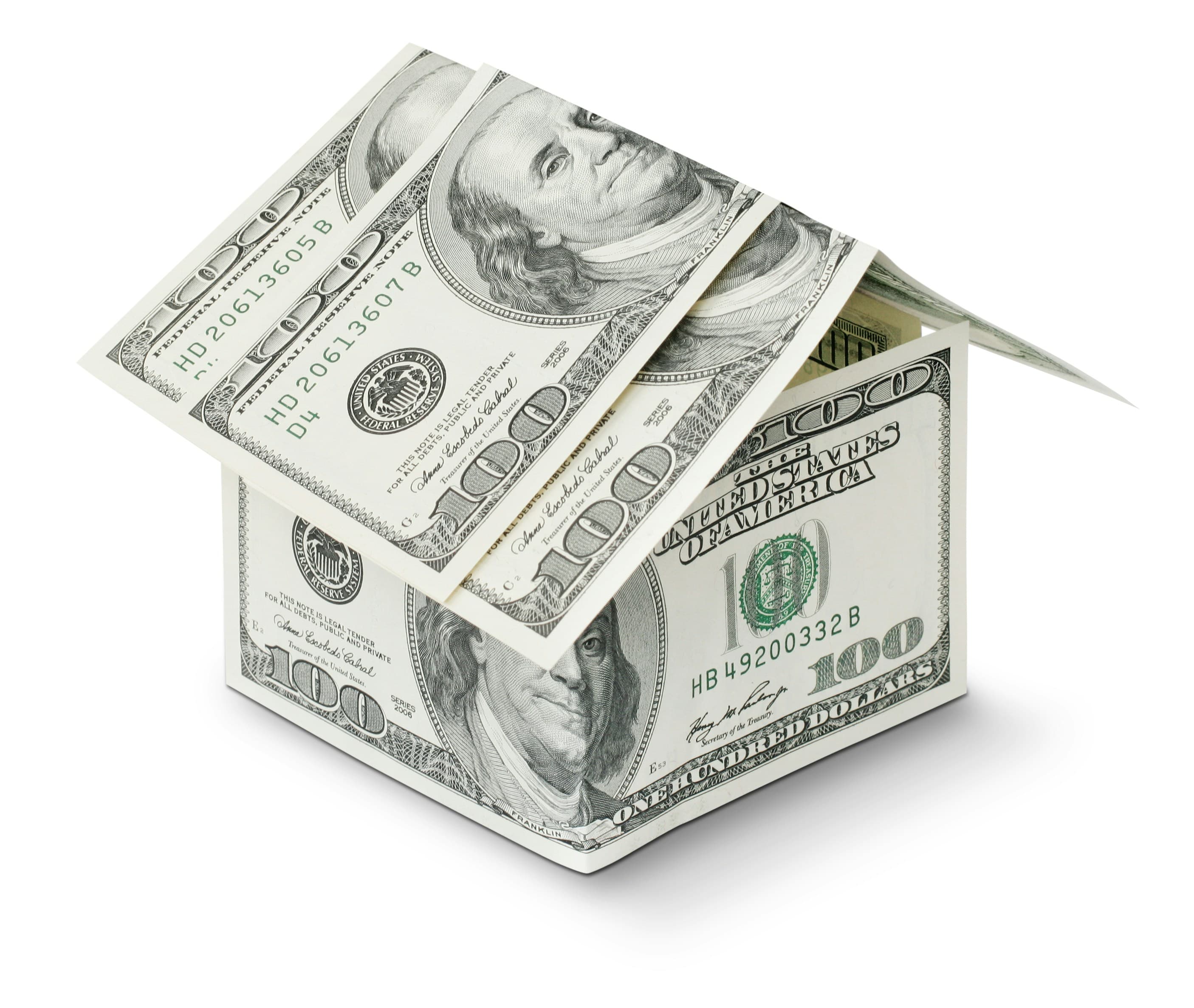 Model house beside Canadian cash, illustrating a home down payment.