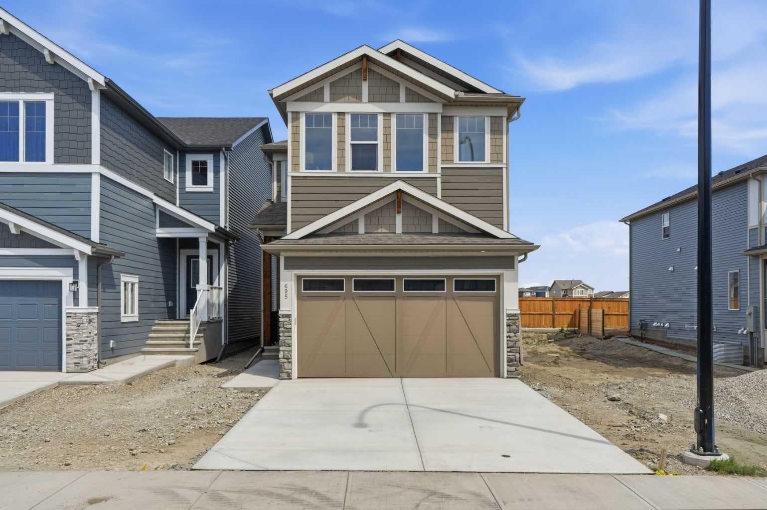 695 Buffaloberry Manor SE — photo 1