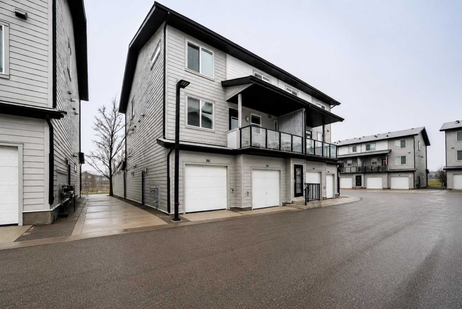 202, 245 Redstone Walk NE — photo 1