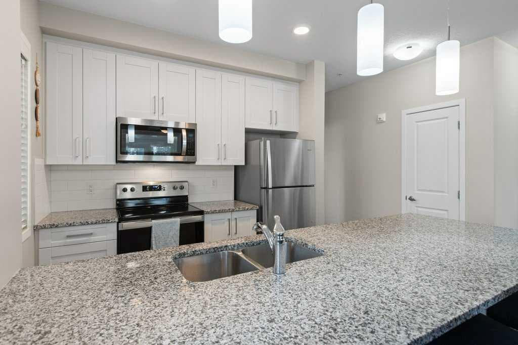 103, 30 Mahogany Mews SE — photo 4